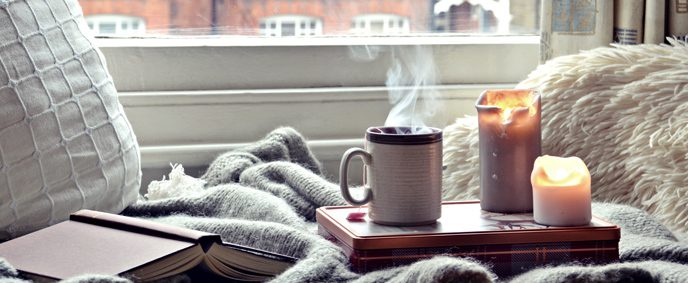 A cozy winter scene is a great reminder of the importance of annual heating maintenance plans.